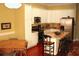 Bright kitchen with white cabinets, stainless steel appliances, and a granite countertop island at 204 Michigan Ave B3 # 16, Folly Beach, SC 29439
