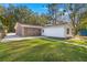 This home has a grassy backyard, a brick exterior and a paved driveway at 205 Owens Dr, Summerville, SC 29485