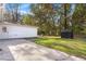 This large backyard features a patio, lawn, fire pit, shed and mature trees at 205 Owens Dr, Summerville, SC 29485