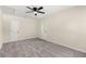 This carpeted bedroom has a ceiling fan, and access to the outdoors at 205 Owens Dr, Summerville, SC 29485