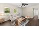 Cozy living room featuring hardwood floors, a ceiling fan, neutral-colored walls, and bright natural light at 205 Owens Dr, Summerville, SC 29485
