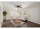 Cozy living room with hardwood floors, a ceiling fan, neutral-colored walls, and stylish furniture at 205 Owens Dr, Summerville, SC 29485