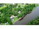 Aerial view of wooded property, water feature, circle driveway, garage and two homesites at 206 Chaussee Blvd, Summerville, SC 29483