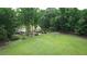 Aerial view of the estate-sized property with a lovely home, a well kept lawn and lots of mature trees at 206 Chaussee Blvd, Summerville, SC 29483
