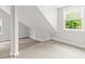 Bright, carpeted attic featuring dormer windows and unique architecture at 206 Chaussee Blvd, Summerville, SC 29483