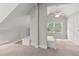 Bright, carpeted attic space with unique architecture and dormer window at 206 Chaussee Blvd, Summerville, SC 29483