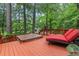 Outdoor deck featuring a hot tub and lounge chair, providing a relaxing and private space at 206 Chaussee Blvd, Summerville, SC 29483