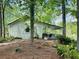 Quaint back of house featuring covered porch, potted plants, ceiling fans, and views of the lake at 206 Chaussee Blvd, Summerville, SC 29483