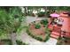 Beautiful backyard featuring manicured landscaping, stone path, and back deck with patio furniture at 206 Chaussee Blvd, Summerville, SC 29483