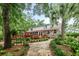 Backyard showing the deck, landscaped yard, and the home's exterior, creating a serene outdoor space at 206 Chaussee Blvd, Summerville, SC 29483