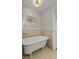 Elegant bathroom featuring a soaking tub with decorative mirror and stylish fixtures at 206 Chaussee Blvd, Summerville, SC 29483