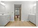 Bright bathroom featuring dual sinks, vanity, and access to a hall at 206 Chaussee Blvd, Summerville, SC 29483