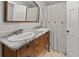 Double vanity in bathroom featuring a marble top and antique wood dresser at 206 Chaussee Blvd, Summerville, SC 29483