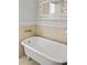 Bathroom with a classic clawfoot tub and unique mirror at 206 Chaussee Blvd, Summerville, SC 29483