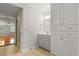 Bathroom featuring modern vanity, cabinets, and shower through a hall at 206 Chaussee Blvd, Summerville, SC 29483