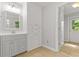 Bathroom featuring modern vanity, cabinets, and an exterior door at 206 Chaussee Blvd, Summerville, SC 29483