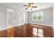 Primary bedroom featuring hardwood flooring, natural light, and en-suite bathroom at 206 Chaussee Blvd, Summerville, SC 29483