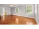 Spacious bedroom with hardwood floors and natural light from dual windows at 206 Chaussee Blvd, Summerville, SC 29483