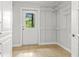 Walk-in closet featuring tiled floor, exterior door, and metal shelving at 206 Chaussee Blvd, Summerville, SC 29483