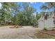 Wide circular driveway leading to the house and garage lined with trees at 206 Chaussee Blvd, Summerville, SC 29483