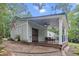 Exterior of home featuring a covered porch with ceiling fans and a comfortable seating area at 206 Chaussee Blvd, Summerville, SC 29483