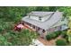 Inviting exterior of two-story home with brick accents, back deck, and lush landscaping at 206 Chaussee Blvd, Summerville, SC 29483