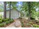 Exterior of cottage house featuring stone pathway and manicured landscaping at 206 Chaussee Blvd, Summerville, SC 29483
