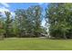 Beautiful home with a sprawling front yard, mature trees, and a well-manicured lawn at 206 Chaussee Blvd, Summerville, SC 29483
