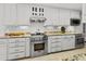 Kitchen featuring stainless steel appliances, granite countertops, and white cabinets at 206 Chaussee Blvd, Summerville, SC 29483
