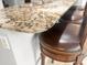 Close up of kitchen granite countertops and barstool seating at the island at 206 Chaussee Blvd, Summerville, SC 29483