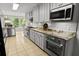Spacious kitchen with stainless steel appliances, granite countertops, and custom cabinets at 206 Chaussee Blvd, Summerville, SC 29483