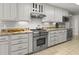 Kitchen featuring stainless steel appliances, granite countertops, and white cabinets at 206 Chaussee Blvd, Summerville, SC 29483
