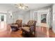 Sitting area with two leather chairs, hardwood floors, and view into adjacent rooms at 206 Chaussee Blvd, Summerville, SC 29483