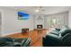 Spacious living room features a fireplace, hardwood floors, and a ceiling fan for added comfort at 206 Chaussee Blvd, Summerville, SC 29483