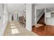 Sunroom with tile flooring, bar seating, and staircase leading to the second floor at 206 Chaussee Blvd, Summerville, SC 29483