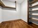 A spacious walk-in closet with wooden floors and custom shelves at 206 Chaussee Blvd, Summerville, SC 29483