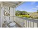 Charming balcony features seating and a scenic view of landscaped grounds at 2063 Long Bend Dr, Seabrook Island, SC 29455