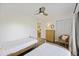 Well-lit bedroom with two twin beds and a wicker chair at 2063 Long Bend Dr, Seabrook Island, SC 29455
