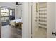 Bright bedroom features a ceiling fan, wood floors, and sliding glass doors to a private balcony at 2063 Long Bend Dr, Seabrook Island, SC 29455
