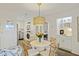 Well-lit dining area with views into the kitchen, laundry, and hallway, featuring a round table at 2063 Long Bend Dr, Seabrook Island, SC 29455