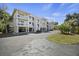 Spacious multi-story building with parking underneath and well maintained landscaping at 2063 Long Bend Dr, Seabrook Island, SC 29455