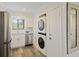Bright kitchen features stainless steel appliances, modern finishes, and a stackable washer and dryer for convenience at 2063 Long Bend Dr, Seabrook Island, SC 29455