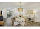 Open floorplan with the dining area and living room visible, showcasing stylish furnishings and outdoor access at 2063 Long Bend Dr, Seabrook Island, SC 29455