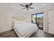 Bright main bedroom with a ceiling fan and sliding door to private deck at 2063 Long Bend Dr, Seabrook Island, SC 29455