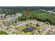 Picturesque aerial view of the home near a pond in a serene community with manicured lawns at 2109 Rowan Rd, Johns Island, SC 29455