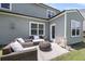 Back patio featuring outdoor seating and access to the home's back door at 2109 Rowan Rd, Johns Island, SC 29455