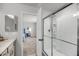 Bathroom and bedroom beyond features a glass-enclosed shower and modern fixtures at 2109 Rowan Rd, Johns Island, SC 29455