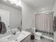 Bathroom with a granite sink, toilet, and shower with decorative curtain at 2109 Rowan Rd, Johns Island, SC 29455