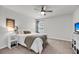 Cozy bedroom features a ceiling fan, comfortable bed, and a window with natural light at 2109 Rowan Rd, Johns Island, SC 29455