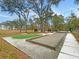Community amenities including a bocce ball court and turf area surrounded by gravel at 2109 Rowan Rd, Johns Island, SC 29455